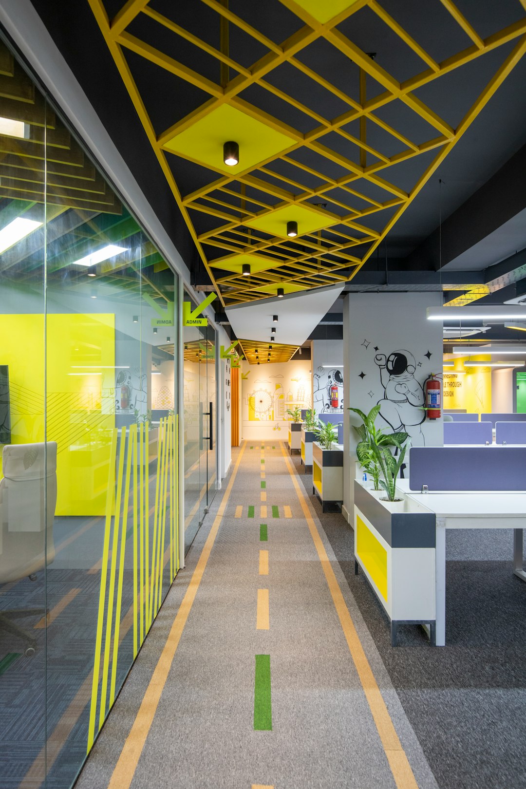 a-long-hallway-with-yellow-and-grey-dividers-gfkcjnenvhw